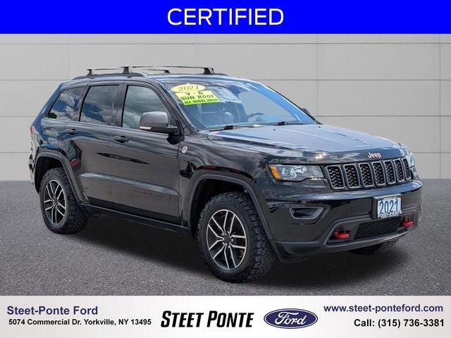 2021 Jeep Grand Cherokee Trailhawk in Diamond Black Crystal Pearlcoat — front three-quarter view
