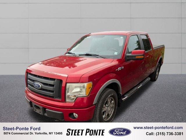 2010 Ford F-150 FX4 in Red Candy Metallic Tinted Clearcoat — front three-quarter view