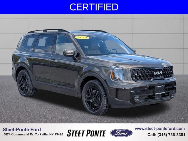 2024 Kia Telluride SX-Prestige X-Line in Dark Moss — front three-quarter view